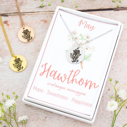 A beautiful birth flower necklace featuring May's birth flower – Hawthorn. The necklace is available in silver, gold or rose gold stainless steel and can be personalised with an engraving on the reverse.
