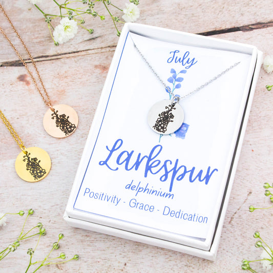 A beautiful birth flower necklace featuring July's birth flower – Larkspur. The necklace is available in silver, gold or rose gold stainless steel and can be personalised with an engraving on the reverse.