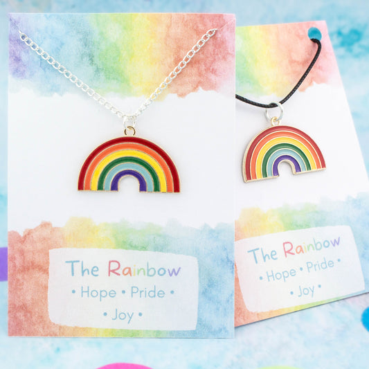 Enamel rainbow charm necklace available on either silver chain or black cord. Backed on a card with the meanings of hope, pride and joy.