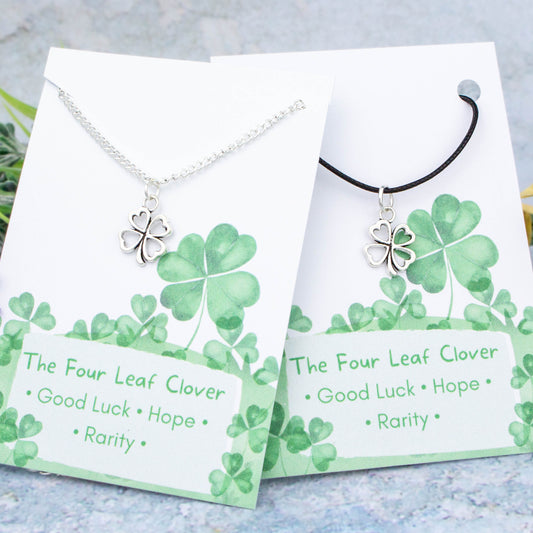 Silver four leaf clover charm necklace available on either silver chain or black cord.
