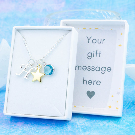 Gold Star charm necklace with a silver initial and birthstone. Presented in a gift box with a personalised message insert.