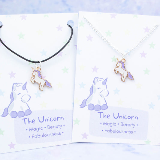 Purple unicorn charm necklace available on either silver chain or black cord.
