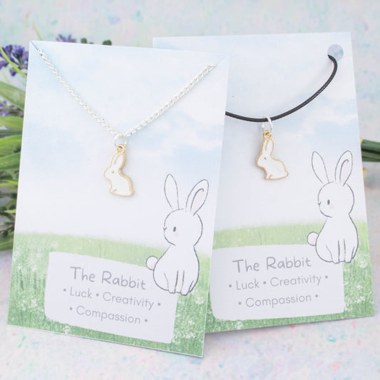 White rabbit charm necklace available on either silver chain or black cord.