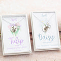 The two birth flower necklaces for April - Tulip and Daisy.