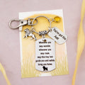 This shows the fully personalised travel lion keyring which includes the silver lion charm, the engraved quote tag which reads: “Wherever you may wander, wherever you may roam, may this tiny lion guide you and bring you safely home” a birthstone and a mini engraved gift message tag. It also has a clasp to attach to a bag. 