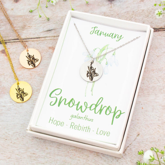 A beautiful birth flower necklace featuring January's birth flower - the Snowdrop. The necklace is available in silver, gold or rose gold stainless steel and can be personalised with an engraving on the reverse.