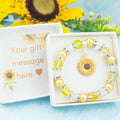 A sunflower charm bracelet made with yellow beads. It is in a personalised gift box. 