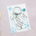 The travel Penguin gift keyring shown with a birthstone and mini tag but no bag clasp. 