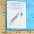 Gold star charm bookmark and card shown against a ruler 