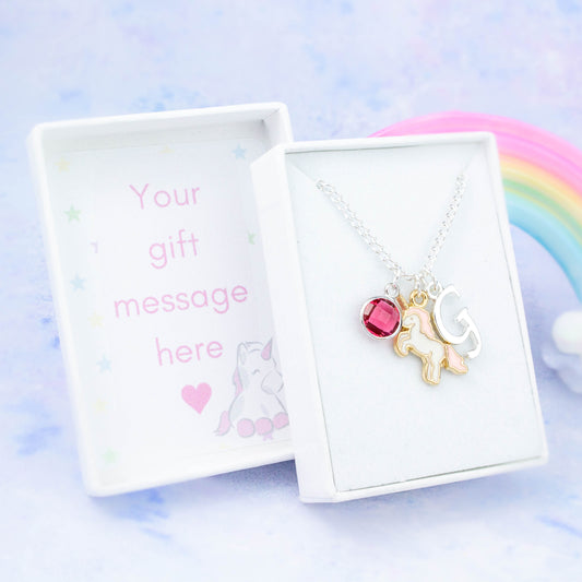 Enamel pink unicorn charm necklace with an initial and birthstone. Presented in a gift box with a personalised message insert.