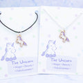 Purple unicorn charm necklace available on either silver chain or black cord.  