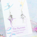 3D Gymnast Charm Earrings on silver hooks, backed onto a card with its symbolic meanings. 