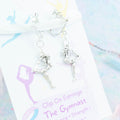 3D Gymnast Clip On Earrings on silver hooks, backed onto a card with its symbolic meanings. 